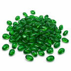 Pile of glossy green glass pebbles on a white background.