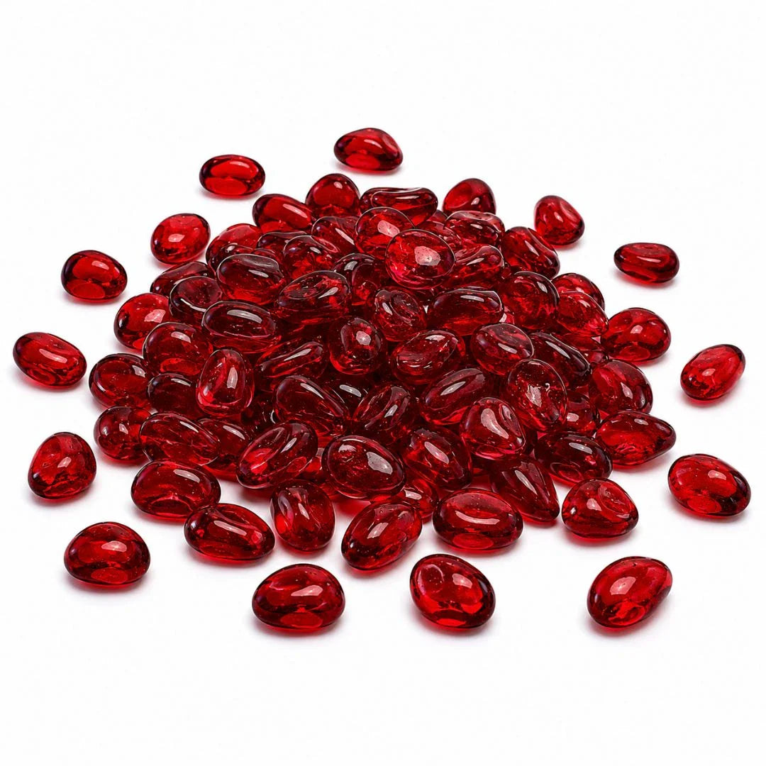 Pile of glossy red glass pebbles on a white background.